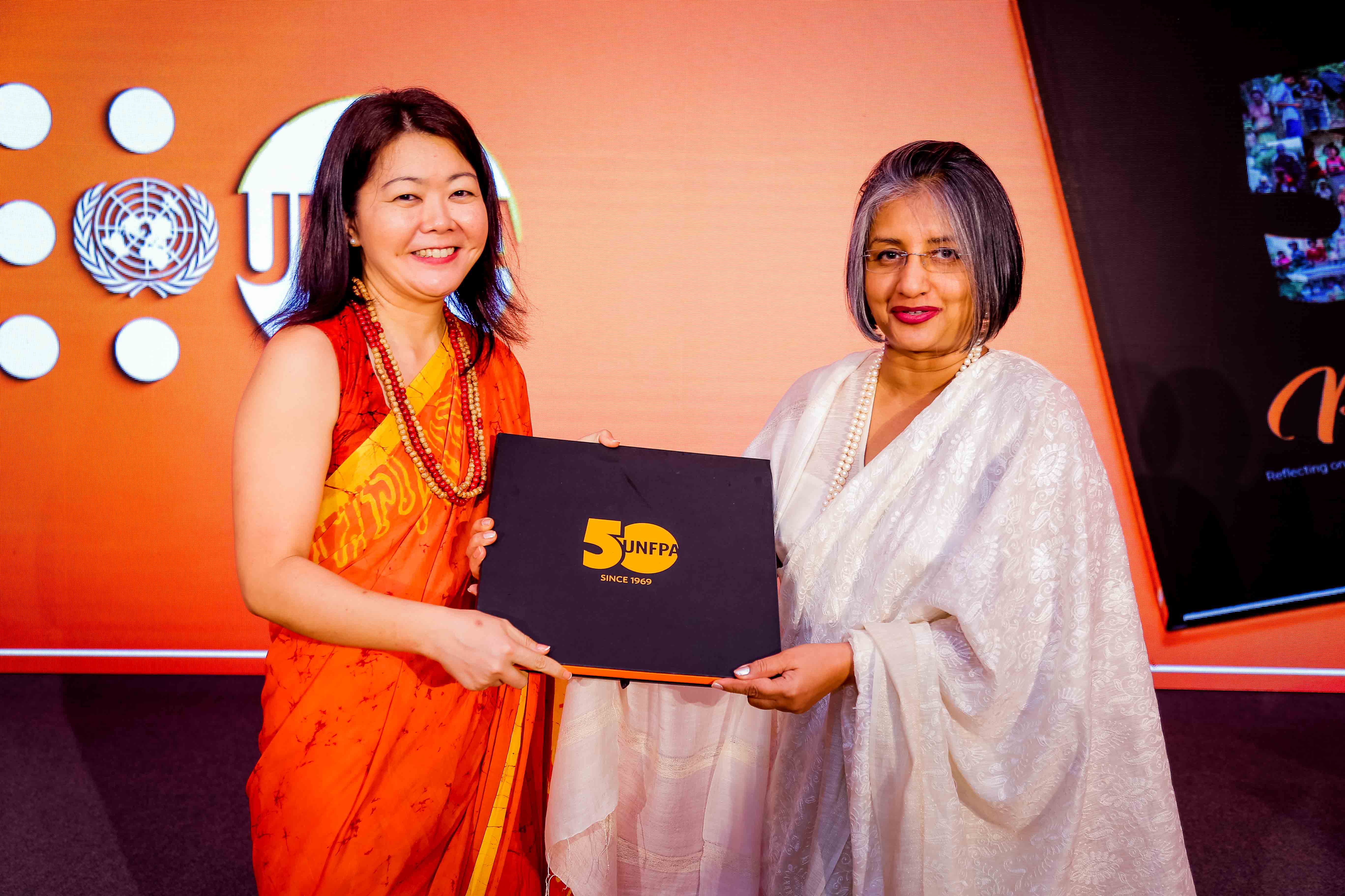 Ms. Ritsu Nacken handing over the first copy of 'Perspectives' to Prof. Maithree Wickramasinghe